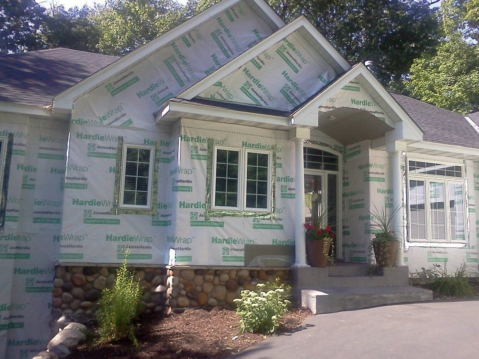 A home with Hardie wrap installed before the new James Hardiw siding is installed.