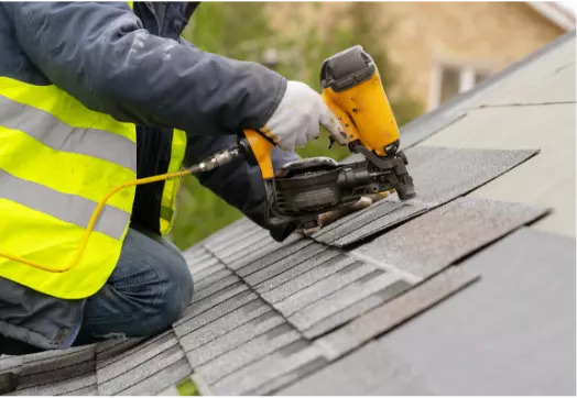 roofer replacing shingles