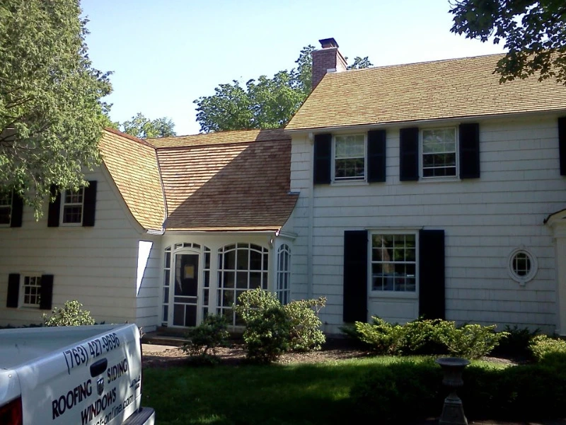 A Bloomington area home with new siding installed by Midwest Roofing, Siding & Windows.