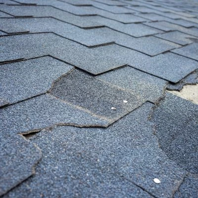 damaged shingles on a residential roof