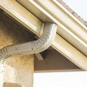 Closeup view of a gutter on a house.